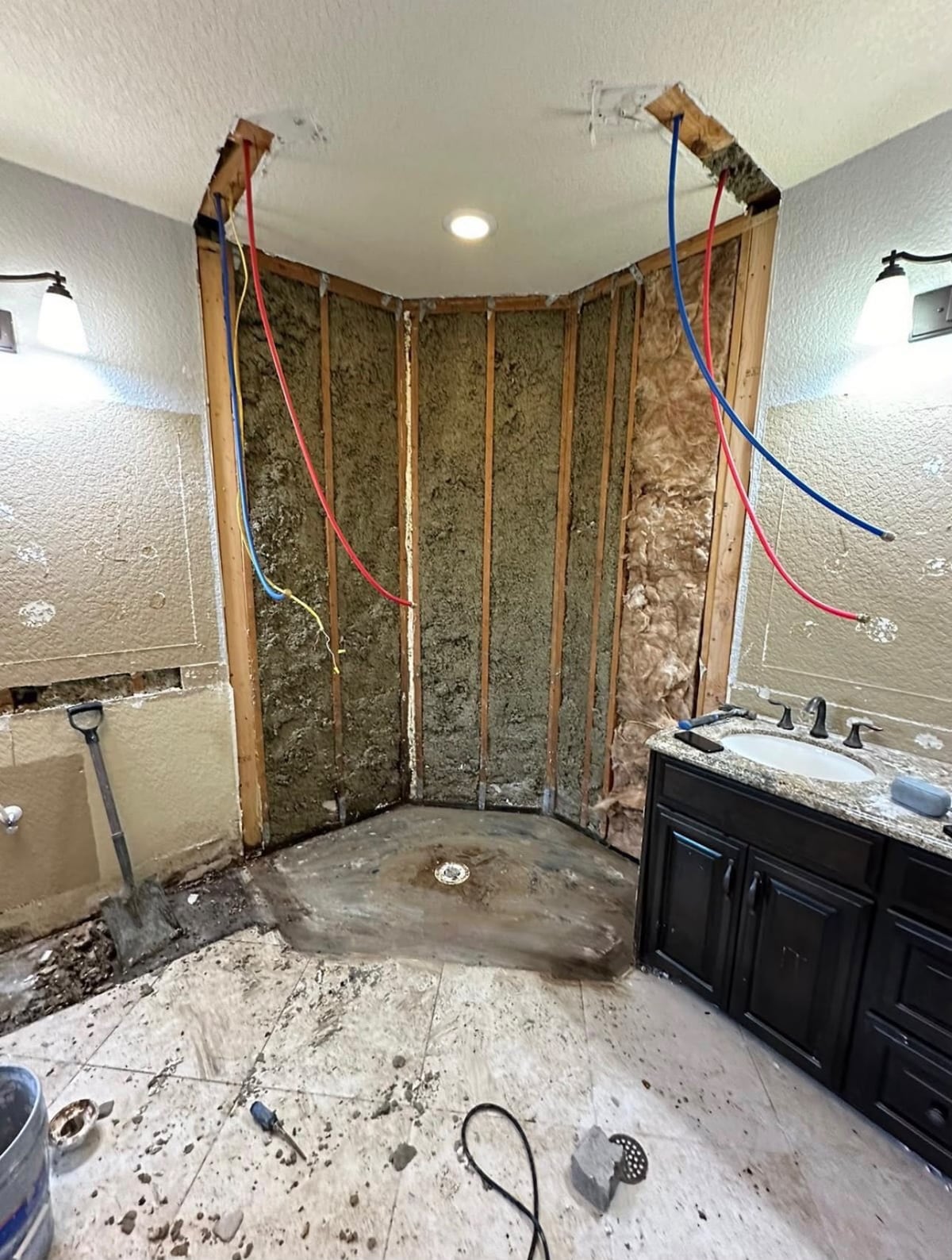 Shower area opened to the studs during a Houston bathroom remodel