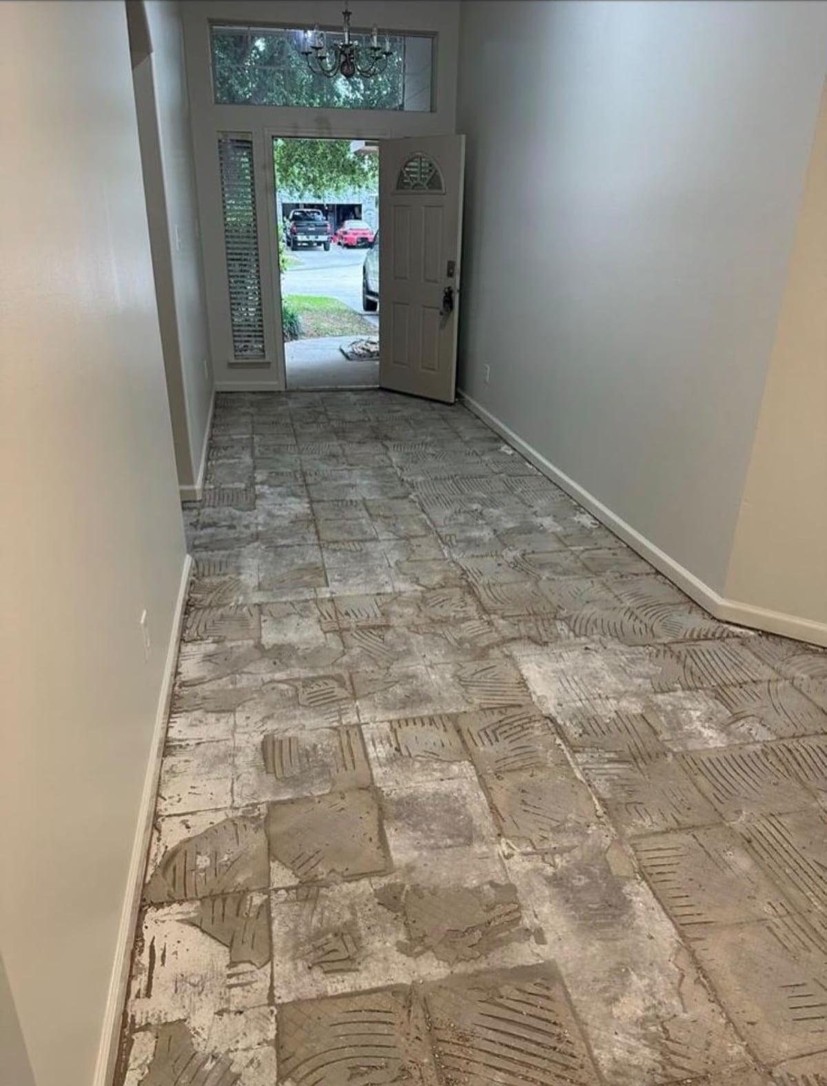 Interior hallway after old tile flooring was removed